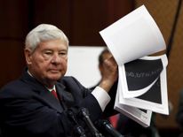 Former Senator Graham shows blacked out 9/11 financial report at news conference on Capitol Hill in Washington to unveil "The Transparency for the Families of 9/11 Victims Act"