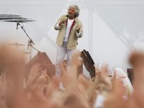 Leader of the Five Star Movement and comedian Grillo gestures while speaking during an election campaign for European Parliament elections in Rome