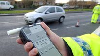 A police officer holds a breath test kit in Doncaster