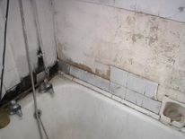 The bathroom of a house raided by council, officers, immigration and police