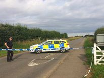 Police on Ladywood Road near RAF Marham, after a serviceman was attacked