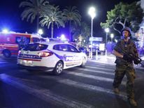 French soldiers and police secure the area after at least 30 people were killed in Nice, France, when a truck ran into a crowd celebrating the Bastille Day national holiday July 14, 2016. REUTERS/Eric Gaillard