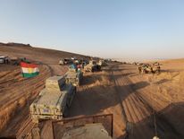 Military vehicles of the Kurdish Peshmerga forces southeast of Mosul, Iraq