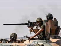 Turkish forces on a tank heading for Syria from the border city of Karkamis