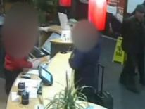 CCTV footage issued by Northamptonshire Police of Edward Tenniswood being escorted out of the Ibis hotel in Northampton after his arrest