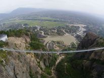 A glass-bottomed suspension bridge spanning this gorge in Stone Buddha Mountain was opened last year
