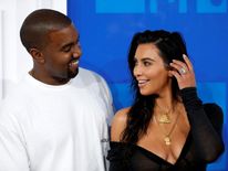 Kanye West and his wife Kim Kardashian also put in an appearance