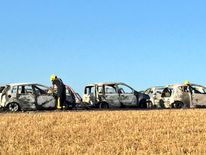 The blaze left behind the charred wrecks of cars