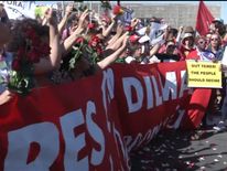 Supporters waved banners and red roses