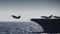 A rafale fighter jet takes off from the French aircraft carrier Charles de Gaulle in the Mediterranean