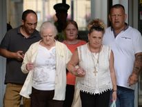 Friends and family of Susan Aucott and Claire Riley leave Northampton Crown Court after both women were sentenced