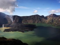 This file picture shows Mt Barujari surrounded by a lake in the caldera of Mt Rinjani