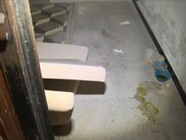 Bowls and liquid on the floor in an apparent prison allegedly used by Islamic State group (IS) militants to imprison and torture women, according to news agency Arab24. 