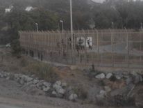 Dozens were left stranded on a fence on the border of the Spanish enclave Ceuta Pic: @M_ALI_LEMAGUE