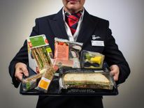 British Airways is to start selling M&S food on short haul flights instead of offering a free snack