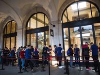 People queuing outside the Apple Store in London