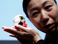 The four-inch tall robot speaks with a high-pitched baby voice 