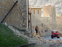 A giant crack down the wall of homes in  Norcia