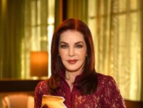 Priscilla Presley with the award for the latest album. Pic: Graceland Archives/Official Charts Company