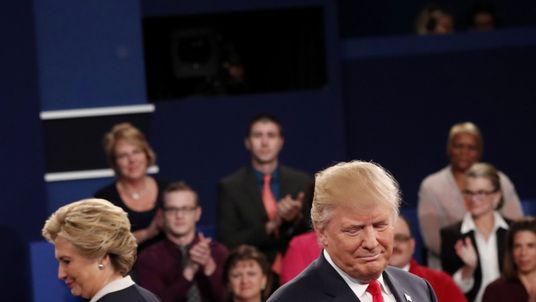 Donald Trump and Hillary Clinton take the stage at the start of their presidential town hall debate