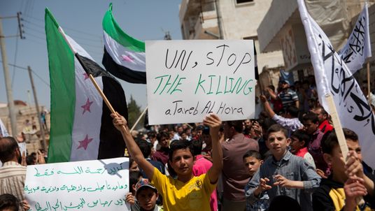 Syrian protesters during an anti-regime demonstration near Aleppo in 2012