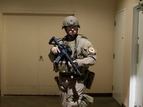 A police officer stands guard backstage following the security scare