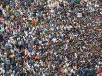 Indian activists from the Trinamool Congress (TMC) political party listen as the Chief Minister of eastern state of West Bengal and TMC leader Mamata Banerjee speaks during a rally as part of a nationwide protest against demonetisation in Kolkata on November 28, 2016. Tens of thousands of people turned out November 28 for nationwide protests against India's controversial ban on high-value banknotes, which opposition party organisers say has caused a 'financial emergency'