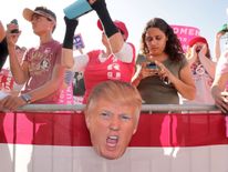 Supporters listen to Republican presidential nominee Donald Trump during a campaign rally the Orlando Amphitheater at Central Florida Fairgrounds