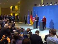 Angela Merkel speaks beside Barack Obama on his final European tour