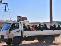 Syrian displaced families arrive at a makeshit camp in the government-held district of Jibreen in Aleppo