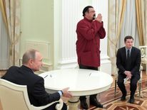 Russian President Vladimir Putin (L) meets with US action hero actor Steven Seagal at the Kremlin in Moscow on November 25, 2016. / AFP / SPUTNIK / Alexey DRUZHININ (Photo credit should read ALEXEY DRUZHININ/AFP/Getty Images)
