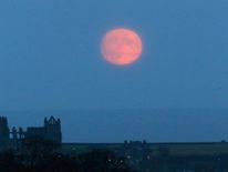 A supermoon rises over Whitby Abbey, in North Yorkshire, Britain November 13, 2016