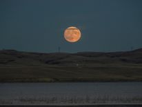 The supermoon rises over the Missouri River, pictured from the Standing Rock Indian Reservation near Cannon Ball, North Dakota, U.S. November 13, 2016