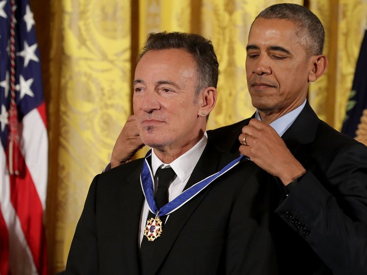 President Barack Obama awards the Presidential Medal of Freedom to popular music singer, songwriter and rock and roll legend Bruce Springsteen during a ceremony in the East Room of the White House