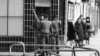 Armed British soldiers patrolling the streets of Belfast in 1972