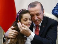 Turkish President Recep Tayyip Erdogan meets with Syrian girl Bana Alabed, known as Aleppo's tweeting girl, at the Presidential Palace in Ankara, Turkey, December 21, 2016
