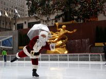 Santa Claus gets his skates on at Rockefeller Centre in Manhattan
