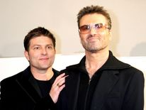 George Michael and his former partner Kenny Goss in 2005