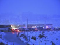 Buses are seen during an evacuation operation of Syrian rebel fighters and civilians from the remaining rebel-held pockets of eastern Aleppo towards rebel-held territory in the west of Aleppo's province on December 21, 2016
