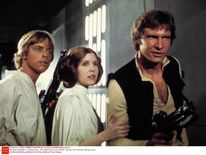 Carrie Fisher starred in Star Wars with Mark Hamill and Harrison Ford