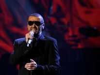 George Michael performs on stage in 2011