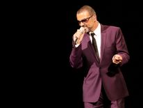 George Michael performs on stage in 2012