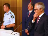 Malcolm Turnbull (R) at the news conference announcing that the alleged plot had been foiled