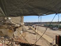 People gather to be evacuated from a rebel-held sector of eastern Aleppo