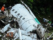 Rescue teams work to recover bodies after the Colombia plane crash