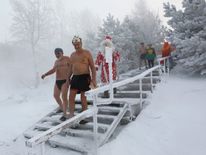 Winter swimming club members head for a dip in Krasnoyarsk, Russia, where the air temperature is around -34C