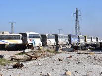 Empty buses head to Aleppo to pick up the final civilians to be evacuated