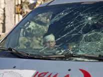 People gather to be evacuated from a rebel-held sector of eastern Aleppo