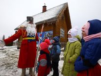A man dressed as Father Frost, similar to Santa Claus, near the village of Goroshki, Belarus