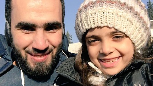 Bana Alabed (right) posing with a journalist after being evacuated from eastern Aleppo. Pic: Twitter / HadiAlabdallah